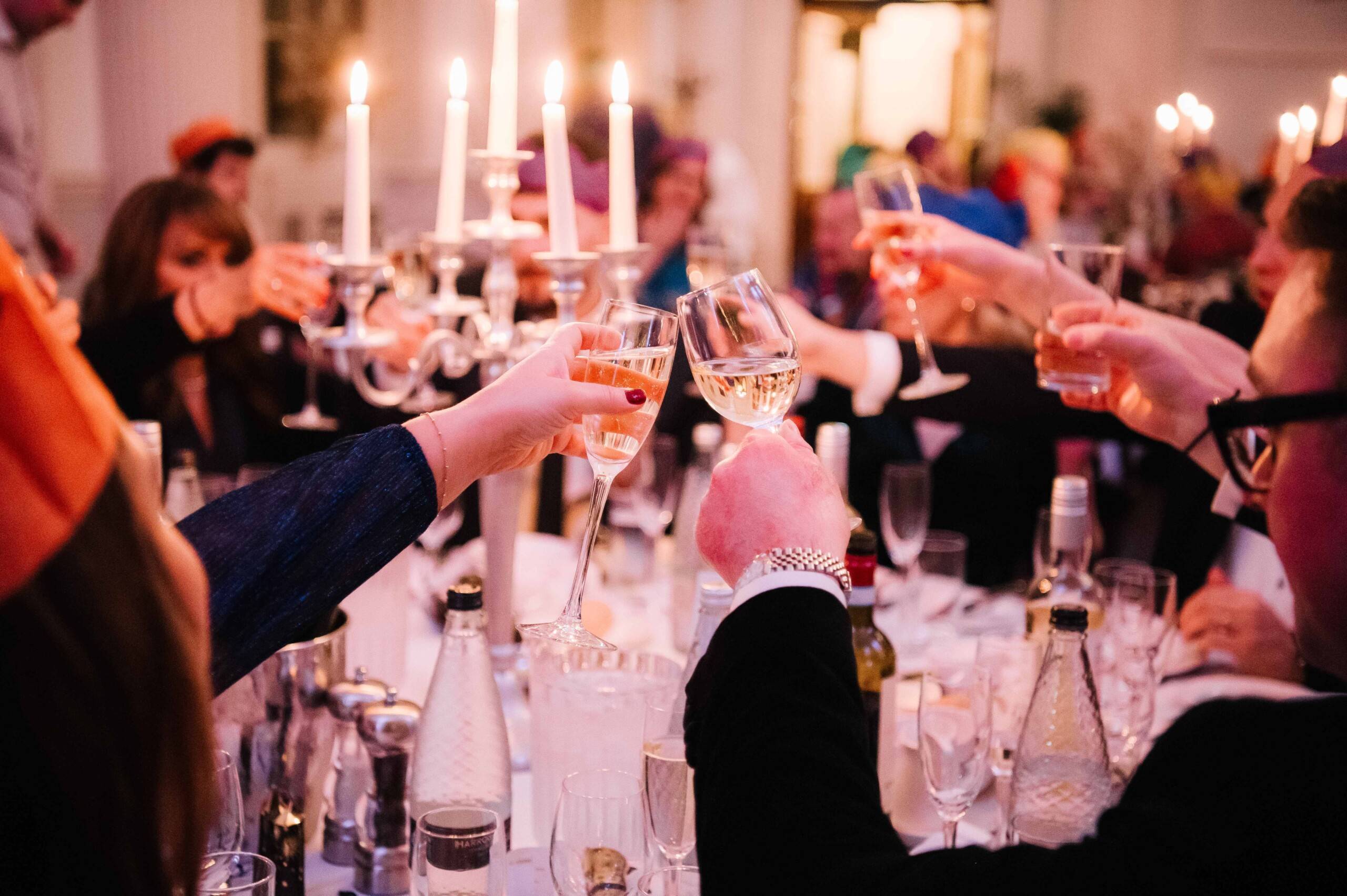 Friends cheers to New Year's Eve at a banquet in the Pump Room